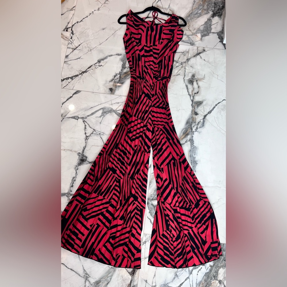 Jumpsuit with lunged front and open back with tie and wide legs